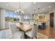 Dining room with access to the kitchen, backyard, and views of the surrounding landscape at 947 Buffalo Ridge Rd, Castle Pines, CO 80108