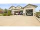 Spacious three car garage with room for multiple vehicles, shelving, and storage at 947 Buffalo Ridge Rd, Castle Pines, CO 80108
