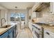 Bright kitchen with breakfast nook with picturesque views, and stainless steel appliances at 947 Buffalo Ridge Rd, Castle Pines, CO 80108