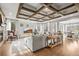 Bright living room with a fireplace and hardwood floors at 947 Buffalo Ridge Rd, Castle Pines, CO 80108
