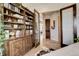 Home office space with a built-in bookcase and dual glass paneled doors at 947 Buffalo Ridge Rd, Castle Pines, CO 80108