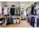 Large walk-in closet with ample storage and organization space at 947 Buffalo Ridge Rd, Castle Pines, CO 80108