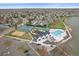 Aerial view of the neighborhood amenities including tennis courts, sand volleyball, playground, and swimming pool at 13420 Lafayette St, Thornton, CO 80241
