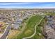 Aerial view of neighborhood adjacent to golf course, showing manicured lawns at 13420 Lafayette St, Thornton, CO 80241