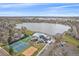 Aerial view featuring community pool, tennis courts, playground, and lake at 13420 Lafayette St, Thornton, CO 80241