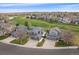 Inviting home overlooking a golf course, featuring an attached garage and a well-maintained lawn at 13420 Lafayette St, Thornton, CO 80241