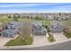 Beautiful home with golf course views, green lawn, and a long driveway with basketball hoop at 13420 Lafayette St, Thornton, CO 80241