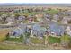 Aerial view of a neighborhood with manicured lawns and a golf course at 13420 Lafayette St, Thornton, CO 80241
