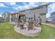 Beautiful backyard with a hot tub, outdoor seating area, and fire pit at 13420 Lafayette St, Thornton, CO 80241