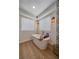 Relaxing bathroom featuring a modern freestanding tub and stylish wall sconces at 13420 Lafayette St, Thornton, CO 80241