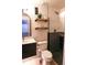 Modern bathroom with sleek vanity, floating shelves, and a glass-enclosed shower at 13420 Lafayette St, Thornton, CO 80241