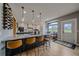 Spacious kitchen island with granite countertops, barstool seating, and a wine rack display at 13420 Lafayette St, Thornton, CO 80241