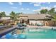 Stunning backyard featuring a pool, comfortable seating, and a pergola-covered dining area at 751 Poplar St, Denver, CO 80220
