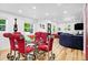 Bright dining room and living room with modern lighting, glass table with red chairs, and hardwood floors at 751 Poplar St, Denver, CO 80220