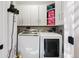 Laundry room features modern appliances, and white cabinets at 751 Poplar St, Denver, CO 80220