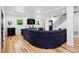 Spacious living room with hardwood floors, recessed lights, and an open layout with staircase at 751 Poplar St, Denver, CO 80220
