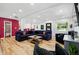Open-concept living room featuring hardwood floors, recessed lighting, and ample seating at 751 Poplar St, Denver, CO 80220