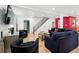 Bright living room features hardwood floors, staircase, modern lighting, and comfortable seating at 751 Poplar St, Denver, CO 80220