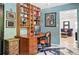 Bright office with built-in shelving, work area, and black and white marble floors at 751 Poplar St, Denver, CO 80220