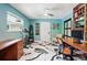 Bright office with built-in shelving, work area, and black and white marble floors at 751 Poplar St, Denver, CO 80220