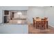 Cozy kitchen features granite countertops and stainless steel appliances, seamlessly connected to the dining area at 1795 S Pitkin St # B, Aurora, CO 80017