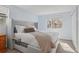 Inviting bedroom with a large window, a cozy bed, and soft natural light, creating a relaxing ambiance at 1795 S Pitkin St # B, Aurora, CO 80017