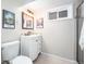 Basement bathroom with shower, toilet and vanity at 6062 Garrison St, Arvada, CO 80004