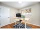 Home office with standing desk and hardwood floors at 6062 Garrison St, Arvada, CO 80004