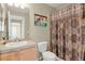 Bathroom boasts a shower/tub combo and updated vanity at 9760 Mayfair St # A, Englewood, CO 80112