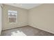 Spacious bedroom with neutral carpeting and large window at 9760 Mayfair St # A, Englewood, CO 80112