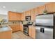 Modern kitchen with ample cabinetry and stainless steel appliances at 9760 Mayfair St # A, Englewood, CO 80112