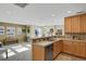 Bright kitchen features ample cabinetry and a breakfast bar at 9760 Mayfair St # A, Englewood, CO 80112