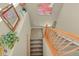 Elegant staircase with wood railings and carpeted steps at 9760 Mayfair St # A, Englewood, CO 80112