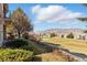 Lush backyard overlooking a golf course and hills on a sunny day at 16671 Red Cliff Cir, Morrison, CO 80465
