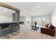 Finished basement features a bar area, seating, and sliding door access to outdoor space at 16671 Red Cliff Cir, Morrison, CO 80465
