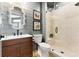 Contemporary bathroom with wood vanity, a glass enclosed shower and a modern design at 16671 Red Cliff Cir, Morrison, CO 80465