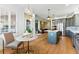 Open kitchen with an island, modern appliances, and a view of the living area at 16671 Red Cliff Cir, Morrison, CO 80465
