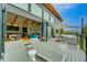 Exterior view of the home showcasing deck with seating, modern design, and scenic views at 20525 Flint Ln, Morrison, CO 80465