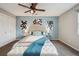 Comfortable bedroom featuring stylish decor and a ceiling fan at 11125 W Alamo Pl, Littleton, CO 80127