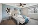 Bright bedroom with large window, stylish decor and a ceiling fan at 11125 W Alamo Pl, Littleton, CO 80127