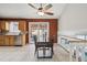Dining area with modern table, natural light, and adjacent staircase at 11125 W Alamo Pl, Littleton, CO 80127