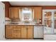 Kitchen featuring light wood cabinets, stainless steel appliances, and natural light at 11125 W Alamo Pl, Littleton, CO 80127