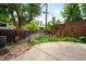 Fenced backyard with patio and brick garage, creating a private outdoor space at 130 S Humboldt St, Denver, CO 80209