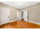 Bright bedroom with hardwood floors, neutral walls, and multiple doorways for easy access at 130 S Humboldt St, Denver, CO 80209