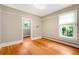 Bedroom with hardwood floors, neutral walls, and two windows for ample natural light at 130 S Humboldt St, Denver, CO 80209