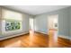 Spacious living room featuring hardwood floors, natural light, and convenient access to other rooms at 130 S Humboldt St, Denver, CO 80209