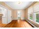 Living room showcasing hardwood floors, window blinds and doorway to kitchen at 130 S Humboldt St, Denver, CO 80209