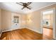Cozy living room featuring hardwood floors, a ceiling fan, and a doorway leading to another room at 130 S Humboldt St, Denver, CO 80209