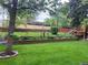 A well-maintained yard, with a play structure, offers a private and enjoyable outdoor space for entertaining and relaxation at 6410 Independence Way, Arvada, CO 80004