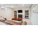 Finished basement with a large TV and plenty of seating provides an ideal space for entertainment at 6410 Independence Way, Arvada, CO 80004